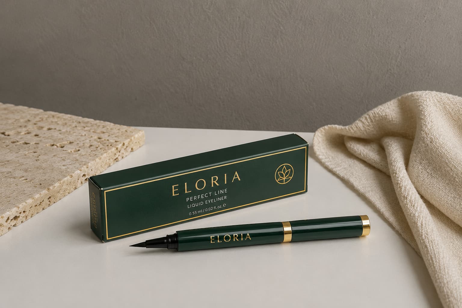 Luxury brow pencil box and brow pencil in black packaging with gold details on a warm textured surface