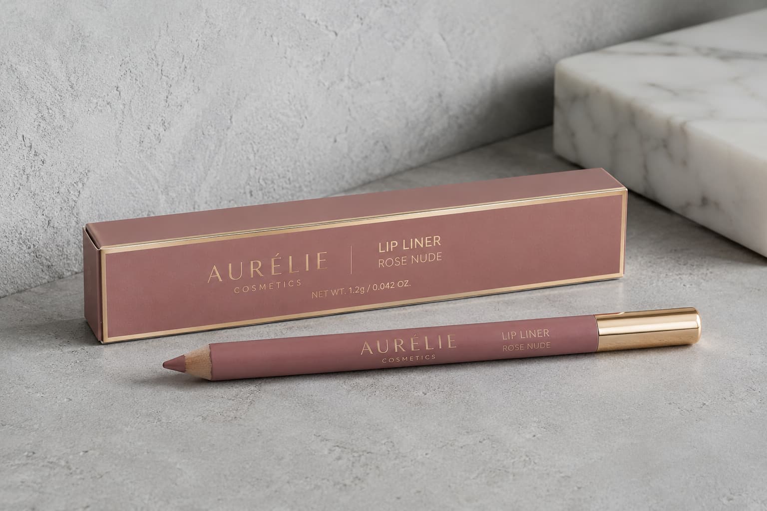 Rose nude custom lip liner box with matching pencil on grey textured background
